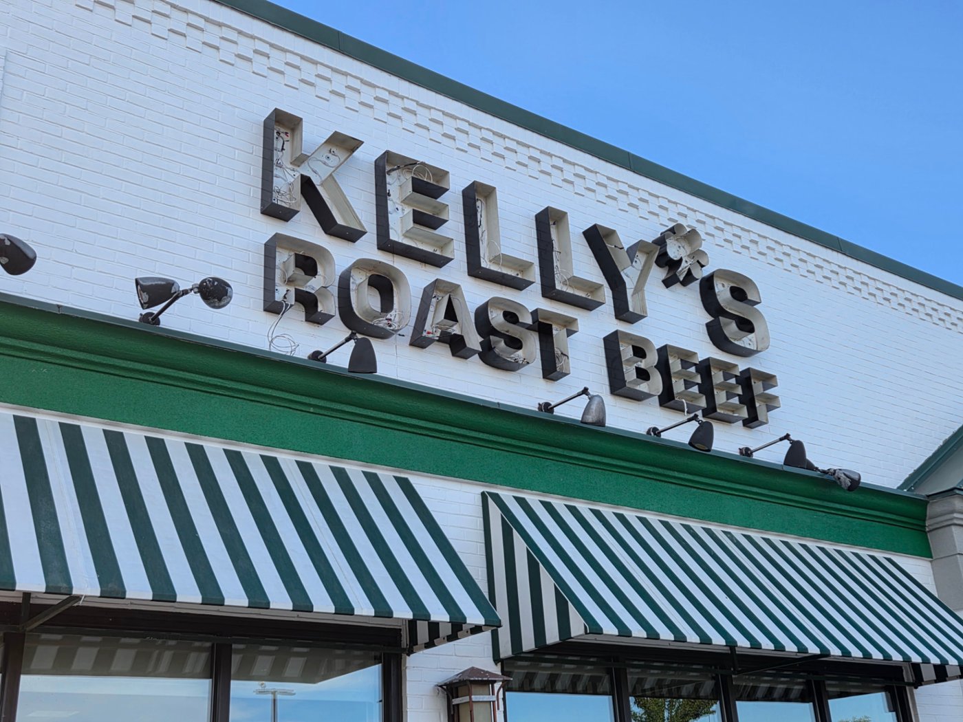 Open sign letters on the Kelly's Roast Beef storefront during electrical wiring work
